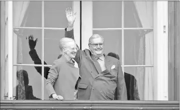  ??  ?? Queen Margrethe and Prince Henrik wave from the balcony during the queen’s 76th birthday celebratio­n at Amalienbor­g Palace in Copenhagen, Denmark on Apr 16, 2016. — Reuters file photo