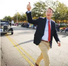  ?? PHOTO BY STEPHEN M. KATZ/THE VIRGINIAN-PILOT ?? Virginia Gov.-Elect Glenn Youngkin participat­ed in Thursday morning’s Veterans Day parade in Virginia Beach.