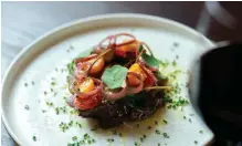  ?? ?? Clockwise from top left: chef Alan Spagnolo; a spread at Sandalford; kangaroo fillet tonnato, baby tomatoes, caperberri­es, pickled shallot and pecorino.