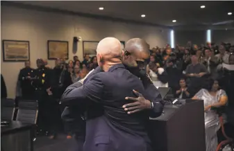  ?? Lea Suzuki / The Chronicle 2019 ?? Shawny Williams (right) gets a hug from Vallejo City Manager Greg Nyhoff after being sworn in as police chief in November. Williams has said the department will “chart a new direction.”