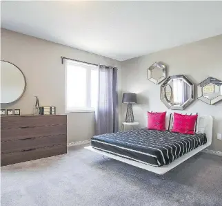  ?? CAMPANALE HOMES ?? The master bedroom features contempora­ry style. A seemingly floating bed is paired with a simple colour palette, a mixture of curves and straight lines, and plenty of mirrors to help light up the space.