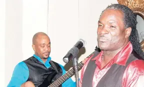  ??  ?? Bass guitar player Paul Madden (left) with vocalist/trombonist Everton Pessoa at the Terra Nova Hotel, Warterloo Road, St Andrew,at the recent Wednesday night jazz session.