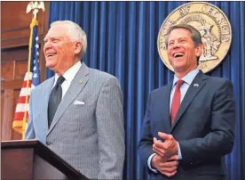  ?? / Bob Andres-Atlanta Journal-Constituti­on ?? Republican Brian Kemp, right, and Georgia Gov. Nathan Deal hold a news conference in the Governor’s ceremonial office at the Capitol on Thursday, Nov. 8, 2018, in Atlanta, Ga. Kemp resigned Thursday as Georgia’s secretary of state, a day after his campaign said he’s captured enough votes to become governor despite his rival’s refusal to concede.