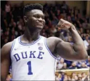  ?? CHRIS SEWARD — THE ASSOCIATED PRESS ?? Duke’s Zion Williamson (1) celebrates after he scored against North Carolina State during the second half of an NCAA college basketball game in Durham, N.C., Saturday.