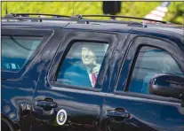  ?? AL DIAZ/ MIAMI HERALD ?? Former President Donald Trump arrives in West Palm Beach, Fla. in his motorcade, on the way to Mar-a Lago on Wednesday. Trump and much of his family plan to make their homes in Florida for the immediate future.