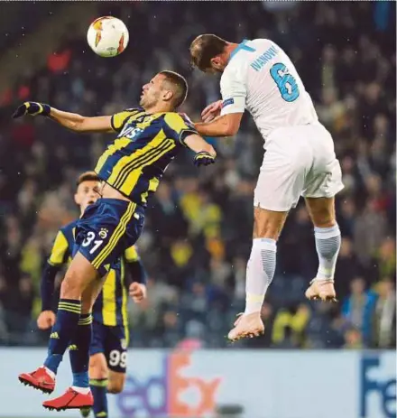  ?? EPA PIC ?? Zenit’s Branislav Ivanovic (right) and Fenerbahce’s Islam Slimani vie for the ball in their Europa League last 32 first leg match in Istanbul on Tuesday.