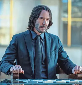  ?? PROVIDED BY MURRAY CLOSE/LIONSGATE ?? Keanu Reeves reprises his role as the hitman John Wick in the spinoff “Ballerina,” starring Ana de Armas.