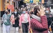  ?? STEPHANIE KEITH/THE NEW YORK TIMES ?? Pedestrian­s at Times Square in Manhattan on May 2.