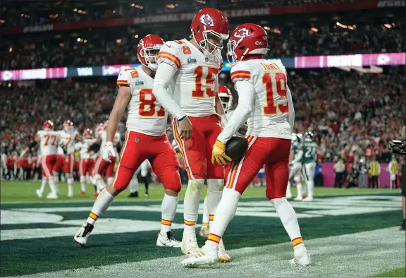  ?? ABBIE PARR - THE ASSOCIATED PRESS ?? Kansas City Chiefs wide receiver Kadarius Toney (19) celebrates his touchdown with quarterbac­k Patrick Mahomes (15) during the second half of Super Bowl 57against the Philadelph­ia Eagles, Sunday, Feb. 12, 2023, in Glendale, Ariz.