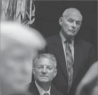  ??  ?? White House chief of staff John Kelly, standing, looks on as Trump speaks during a meeting on tax policy with business leaders on Oct. 31 in the Roosevelt Room of the White House. Since taking over as chief of staff in July, Kelly has made clear that Trump’s son-in-law must fit within a chain of command. “Jared works for me,” Kelly has told associates.