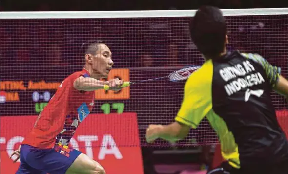  ??  ?? Malaysia’s Lee Chong Wei (left) in action against Indonesia’s Anthony Sinisuka Ginting in a Thomas Cup quarter-final tie at the IMPACT Arena in Bangkok yesterday.