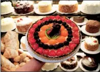  ??  ?? Fruit tarts are among the delicacies at Silvek’s European Bakery, which, if owner Silvek Pupkowski finds a buyer, will move in March from the Kroger store in Pulaski Heights, and if he doesn’t find a buyer, will close.