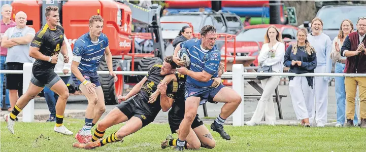  ?? Rob. Hockney ?? ●●Sam Broster using his power to break the tackle to score for Macclesfie­ld against Northwich at the weekend. See pages 38 and 39