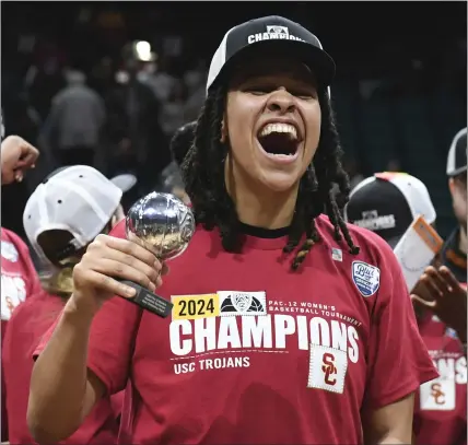  ?? CANDICE WARD — GETTY IMAGES ?? McKenzie Forbes celebrates being named MVP of the Pac-12 Tournament after USC defeated perennial power Stanford in the title game.