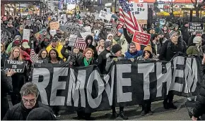  ?? AP ?? An anti-President Donald Trump crowd gather at a rally to protest and call for his impeachmen­t in New York yesterday.