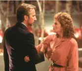  ??  ?? The villainous Hans Gruber (Alan Rickman) wreaks havoc for hostage Holly McClane (Bonnie Bedelia) in the 1988 action-packed “Die Hard.”