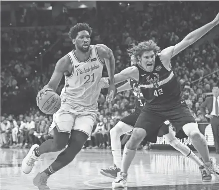  ?? ERIC HARTLINE / USA TODAY SPORTS ?? Philadelph­ia center Joel Embiid and the 76ers defeated Robin Lopez and the Bucks on Christmas Day, but the two teams have gone in different directions in the Eastern Conference since.