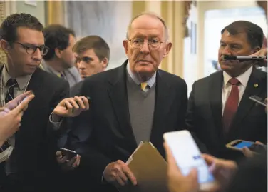  ?? Tom Brenner / New York Times 2017 ?? Sen. Lamar Alexander, a three-term senator and former Tennessee governor, talks to reporters last year.