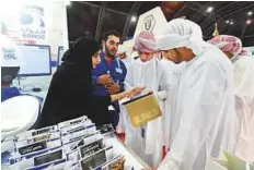  ?? Abdul Rahman/Gulf News ?? Saeed Sultan Al Za’abi and Fatima Al Za’abi of Adnoc Technical Academy explaining about their activities to students.