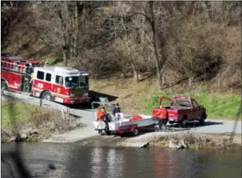  ?? CHRIS SHIPLEY — THE MORNING CALL VIA AP ?? Authoritie­s remove a boat after searching the Lehigh River for Jayliel Vega Batista on Saturday in Allentown, Pa. The body of Batista, 5, who is autistic, was found in a canal about a quarter mile from a relative’s home where the boy wandered away,...