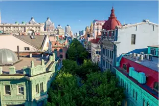  ??  ?? The Central Avenue of Harbin is lined with lush green trees.