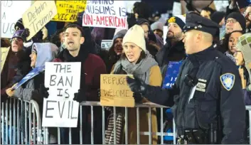  ?? — AFP ?? Protesters gather at JFK Internatio­nal Airport, New York, against US President Donald Trump’s executive order to ban travellers from certain Muslim-majority countries.