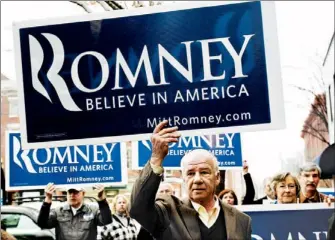  ?? JESSICA RINALDI/REUTERS PHOTO ?? Mitt Romney backers hold signs for the GOP presidenti­al candidate at a rally last month in Keene, N.H. Romney, former governor of neighborin­g Massachuse­tts, has campaigned extensivel­y in New Hampshire.