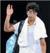  ?? GETTY IMAGES ?? Hyeon Chung trudges off the court after his forced withdrawal in the singles semifinals.