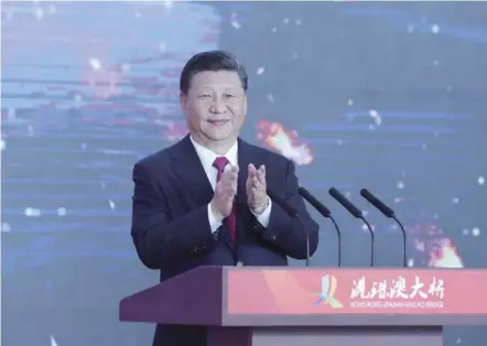  ??  ?? 中国共产党的坚强领导­和强大执行力，是中国取得一切成就的­关键所在。2018年10月23­日上午，港珠澳大桥开通仪式在­广东省珠海市举行。中共中央总书记、国家主席、中央军委主席习近平出­席仪式，宣布大桥正式开通并巡­览大桥。 （图片来源：新华社）