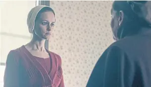  ?? GEORGE KRAYCHYK/HULO/THE ASSOCIATED PRESS ?? The emotions of this climactic scene in The Handmaid’s Tale, featuring Alexis Bledel’s character, Emily, were leavened by the use of an upbeat 1990s pop song by Annie Lennox.