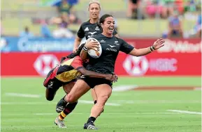  ?? GETTY ?? Stacey Fluhler is run down in the Black Ferns’ big win over Papua New Guinea. Left: Roderick Solo showed himself to be a great prospect for New Zealand.