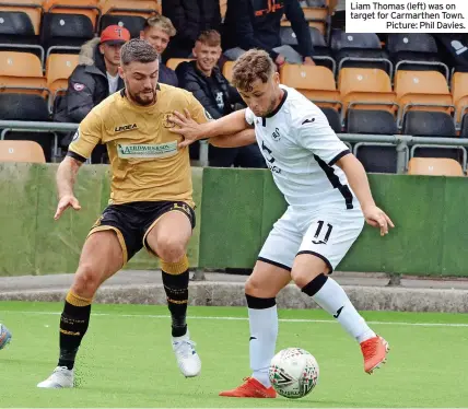  ?? ?? Liam Thomas (left) was on target for Carmarthen Town.
Picture: Phil Davies.