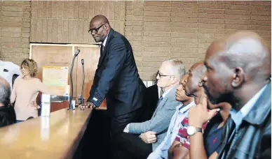  ?? / MDUDUZI NDZINGI ?? William Mpembe and his co-accused appear in the Rustenburg Magistrate’s Court to face murder charges emanating from the Marikana uprising in 2012.