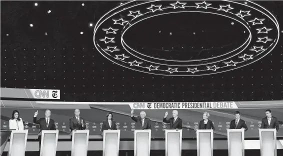  ?? John Minchillo / Associated Press ?? Twelve candidates participat­ed in the Democratic presidenti­al primary debate held at Otterbein University in Westervill­e, Ohio, a crucial swing state.