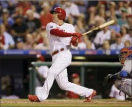  ?? MATT SLOCUM — THE ASSOCIATED PRESS ?? Phillies slugger Rhys Hoskins knows that the addition of first baseman Carlos Santana means he will spend more time in left field.
