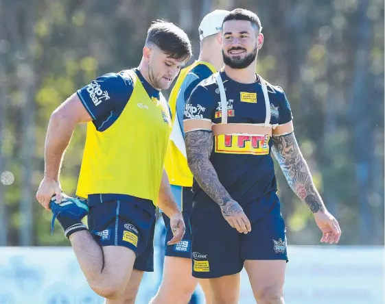  ?? Picture: AAP IMAGE ?? Nathan Peats (right) with fellow Titans hooker Mitch Rein at training.