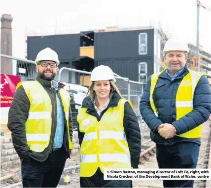  ??  ?? > Simon Baston, managing director of Loft Co, right, with Nicola Crocker, of the Developmen­t Bank of Wales, centre