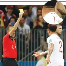  ?? FRANCISCO SECO/THE ASSOCIATED PRESS ?? Referee Cuneyt Cakir shows a yellow penalty card to England’s Kyle Walker, right, during the semifinal match between Croatia and England at the 2018 soccer World Cup in the Luzhniki Stadium in Moscow, Russia.