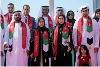  ??  ?? Dr Amal Qubaisi, Speaker of the Federal National council, and Staff at FNc headquarte­rs in Abu Dhabi.