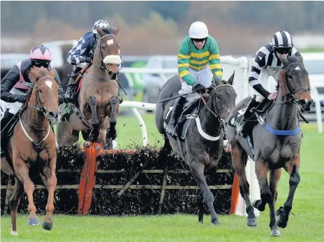  ??  ?? Barry Geraghty made the perfect return to action on Buveur D’Air in the Unibet Fighting Fifth Hurdle Race at Newcastle yesterday