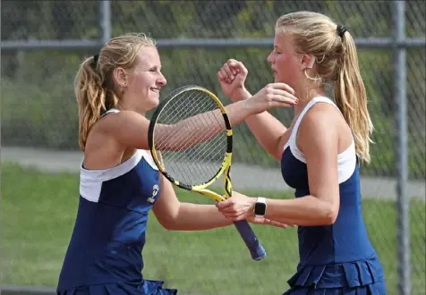 ?? Pittsburgh Post-Gazette ?? Knoch twin sisters Lindsey, left, and Emily Greb — WPIAL Class 2A doubles champions in 2021 — are still around and will be two of the top singles players for the defending Class 2A champion nights this fall.
