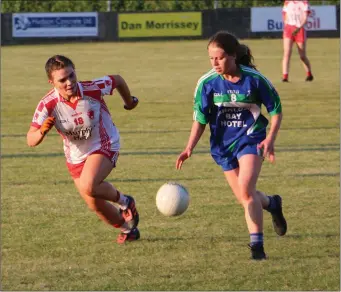  ??  ?? Tinahely’s Emily Mulhall chases AGB’s Sarah Carnett during their league encounter in Pearse’s Park.