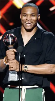  ??  ?? NBA basketball player Russell Westbrook of the Oklahoma City Thunder accepts the award for best male athlete at the ESPYS. (AP)