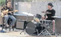  ?? CONTRIBUTE­D ?? The Darvel spent much of last summer performing at the outdoor stage at Victoria Row in Charlottet­own. Pictured are Lucas MacCormack, left, and Lucas Proud.