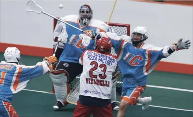  ?? CLIFFORD SKARSTEDT EXAMINER ?? Peterborou­gh Century 21 Lakers’ Cory Vitarelli fires the ball at Six Nations Chiefs’ Dillon Ward during Major Series Lacrosse action Friday night at the Iroquois Lacrosse Arena in Ohsweken. The Lakers won 15-9.