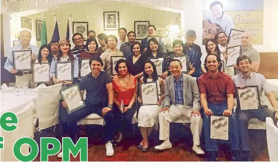  ??  ?? Seated: At the Caruso Italian restaurant in Makati City, Jose Mari Chan and wife Mary Ann Ansaldo and sons Franco, Michael and Joe and granddaugh­ter Ramona Isabel Buñag Chan who is one of the ‘Double Platinum’ awardees (others shown at the background)...