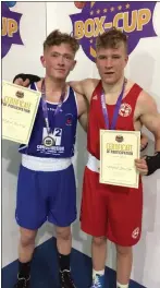  ??  ?? Enniskerry’s Aidan Long (red) with Jack Murphy of St Ibar’s at the Weford Box Cup.