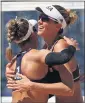  ?? SEAN M. HAFFEY — GETTY IMAGES ?? April Ross, left, hugs U.S. teammate Alix Klineman after beating Switzerlan­d in the beach volleyball semis.