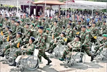  ??  ?? Disabled soldiers on wheel chairs taking part in yesterday’s Victory Day parade at the Galle Face Green in Colombo. President Mahinda Rajapaksa was the chief guest. Pic by Indika Handuwala