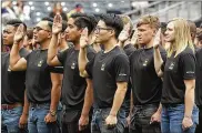  ?? GREGORY BULL / AP 2017 ?? New Army recruits are sworn in before a San Diego Padres game in June 2017. The Army fell about 6,500 soldiers short of its latest recruiting goal.